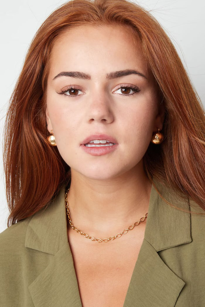 Statement ball earrings made of gold-colored stainless steel