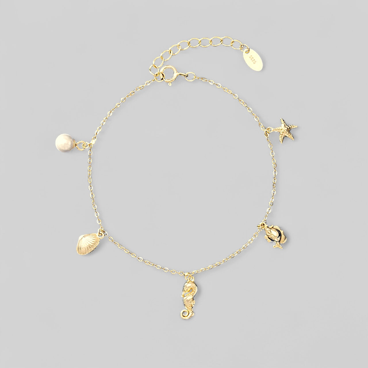 Armkette „Inspired by the Sea“ – Seestern, Süßwasserperle und Muschel – 925 Silber 14K vergoldet
