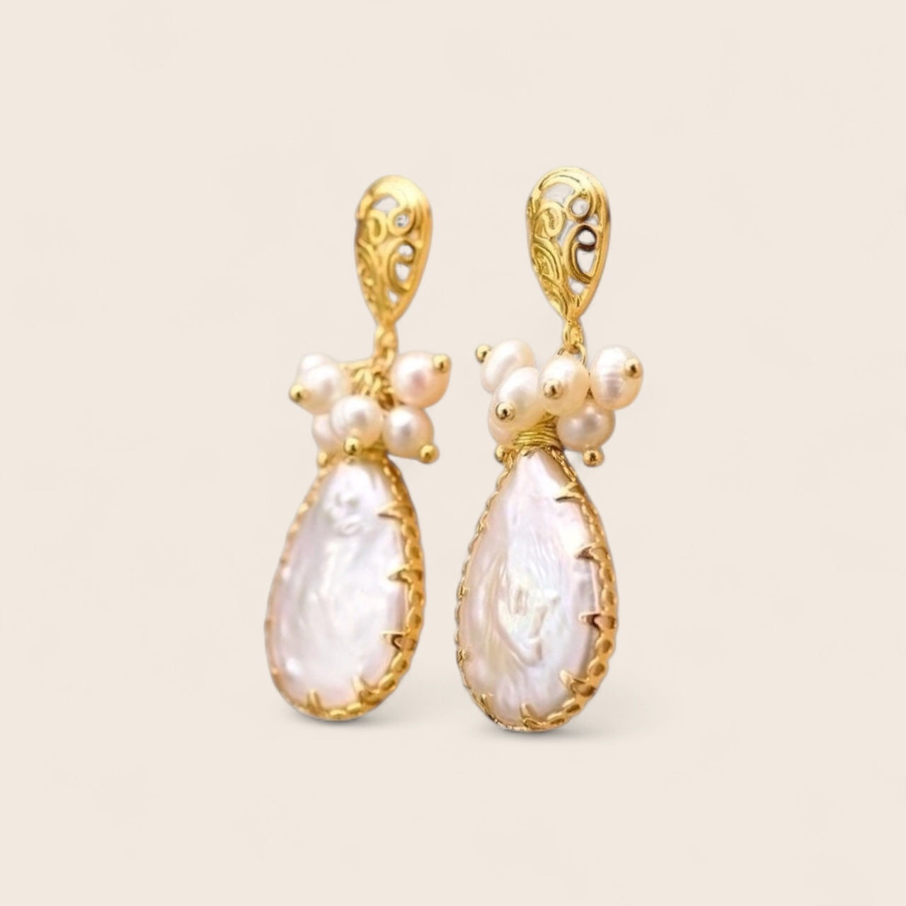 Extravagant earrings with pearls made of 925 silver gold-plated